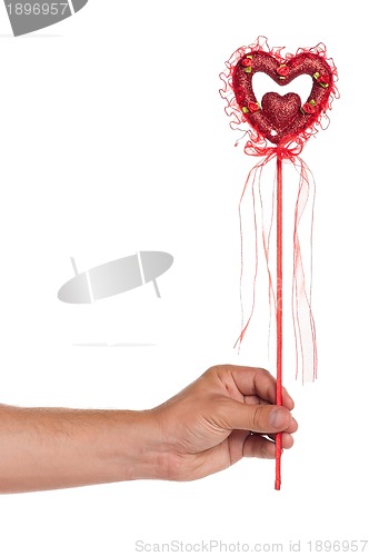 Image of Hand with heart on a stick