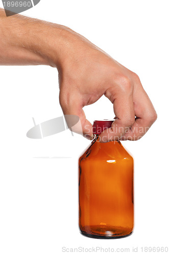Image of Hand with small bottle