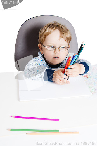 Image of Portrait of the little boy with pencils