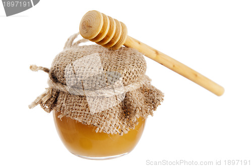 Image of jar of honey, it is isolated on white