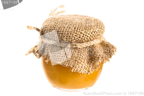 Image of jar of honey, it is isolated on white