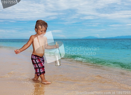 Image of toddler holding sos bottle