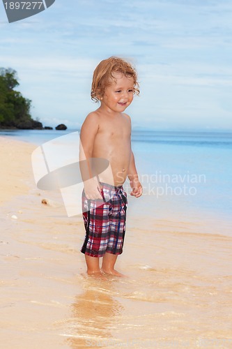 Image of happy kid on the beach