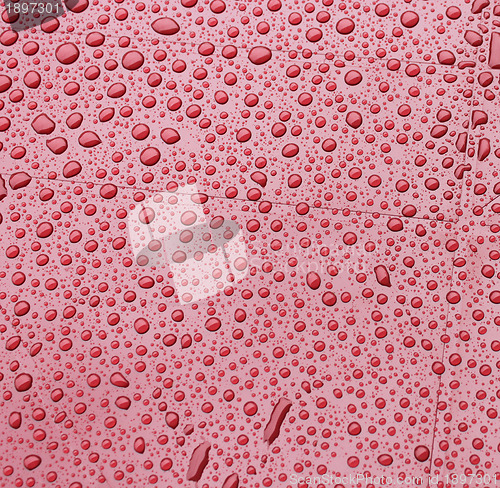 Image of Red plastic during a rain. Background