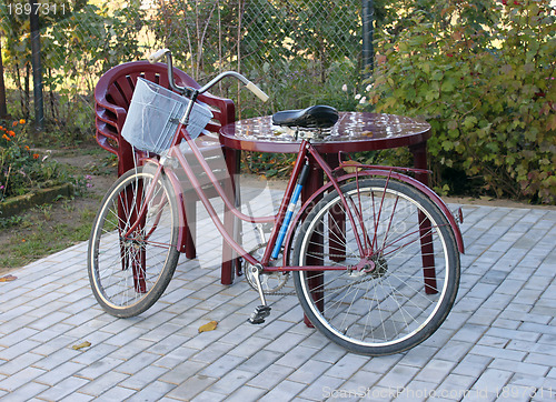 Image of Plastic furniture and old bicycle