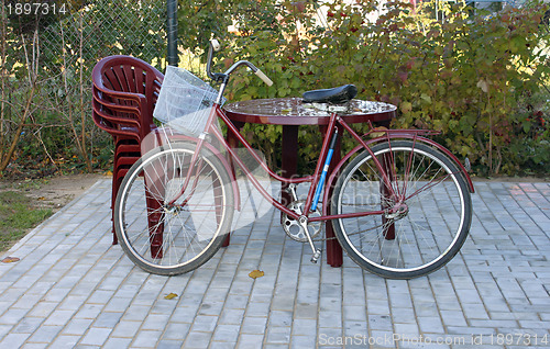 Image of Plastic furniture and old bicycle