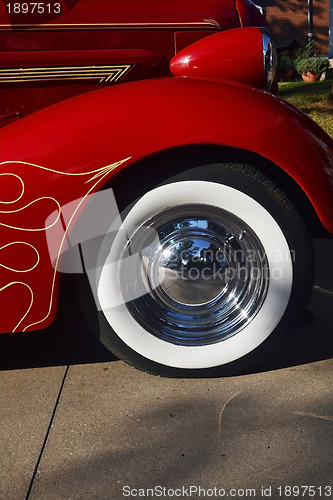 Image of The front tires of a old timer car.