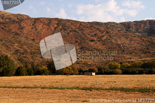 Image of Abandoned Shack Against Majestic Mountain  