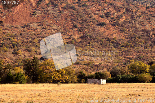 Image of Abandoned Shack Against Majestic Mountain  
