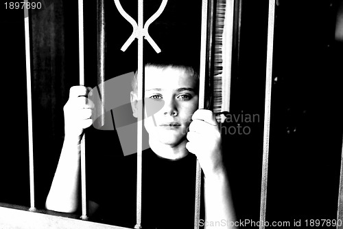 Image of Young Boy Locked Inside House for Protection