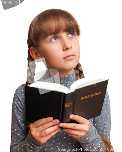 Image of girl reading a  Bible