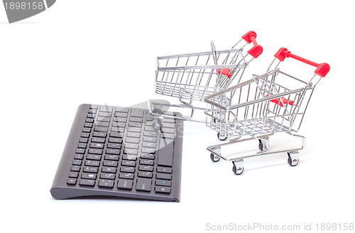 Image of Computer keyboard with shopping carts