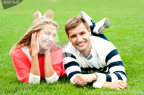Image of Romantic young couple outdoors in the park