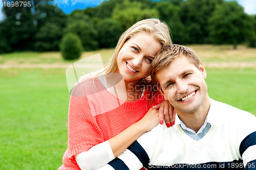 Image of Lovely young couple striking a smiling pose