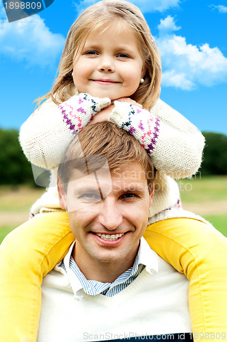 Image of Charming little girl posing with her father