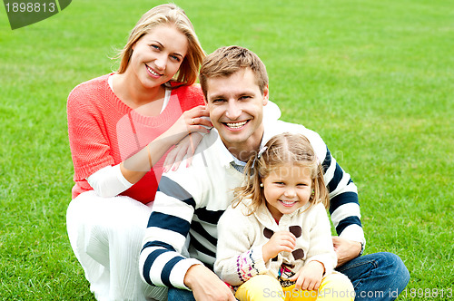 Image of Outdoor happy caucasian family relaxing
