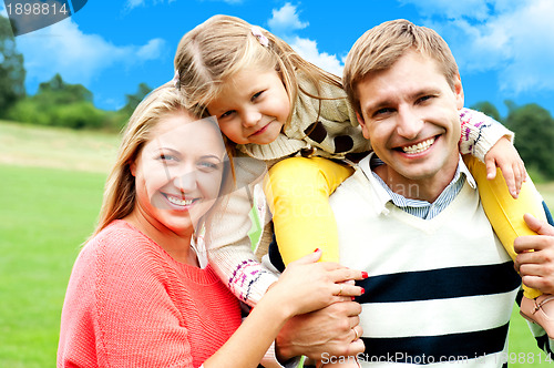 Image of Beautiful happy caucasian family of three