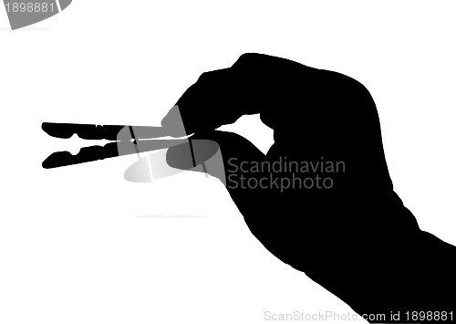 Image of Clothes Peg with Hand Silhouette Isolation 