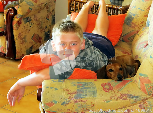 Image of Boy and Dog on Sofa