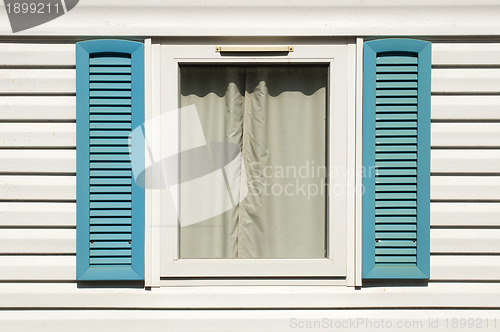 Image of Window with wooden shutters