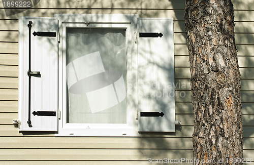 Image of Window with wooden shutters