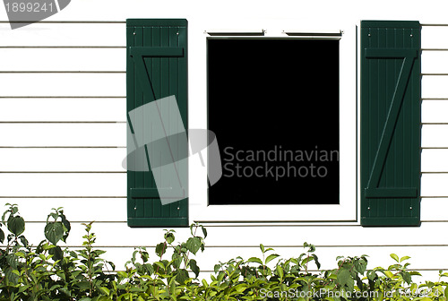 Image of Window with wooden shutters