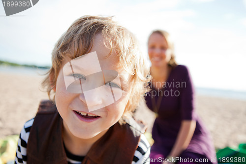 Image of Boy and mother and the beach.
