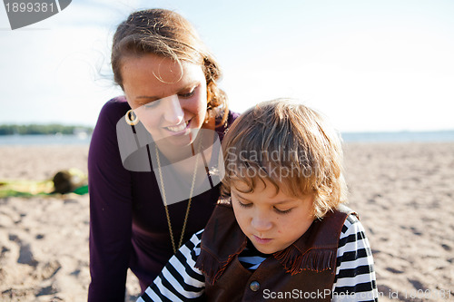 Image of Mother and son at beach.