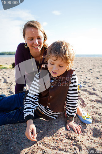 Image of Mother and son at beach.