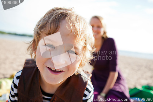 Image of Boy and mother and the beach.