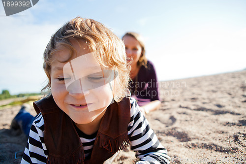 Image of Mother and son at beach.