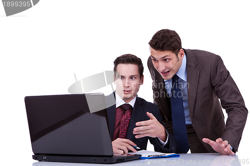 Image of two shocked business men