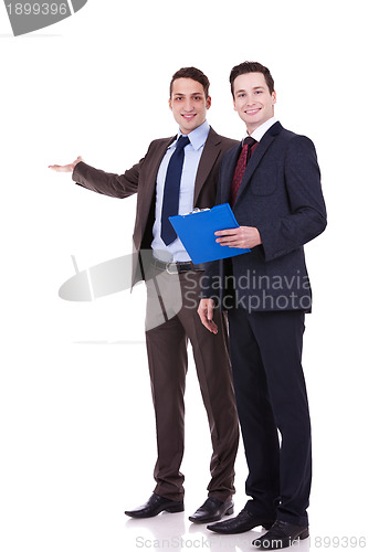 Image of two young business men presenting 