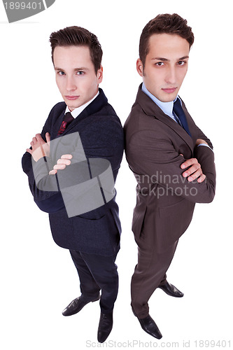 Image of two serious young men with arms crossed 