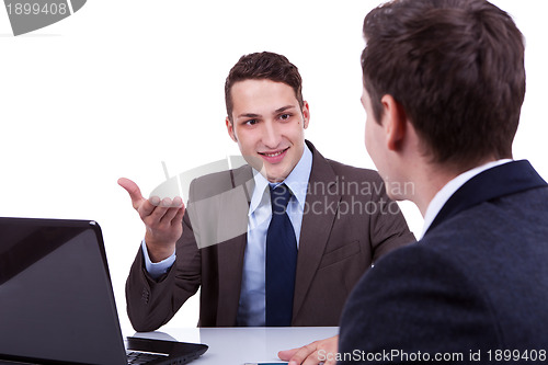 Image of young business men having a discussion