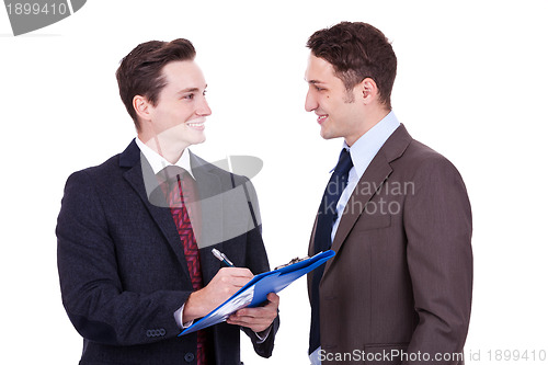 Image of business people standing working in team