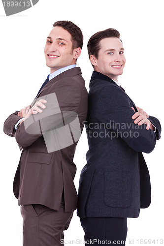 Image of back to back businessmen smiling