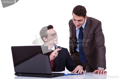 Image of confident businessmen sharing ideas