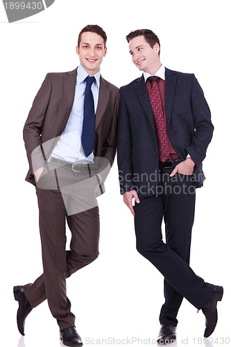 Image of  business friends standing shoulder to shoulder