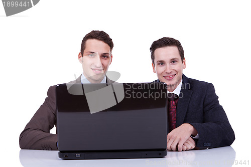 Image of Two business men at a desk