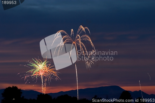 Image of Firecrackers In The Sky During Sunset