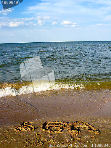 Image of Marine waves and inscription