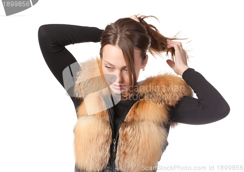 Image of Stylish woman in winter fur jacket