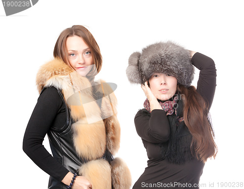 Image of Two attractive women dressed for winter