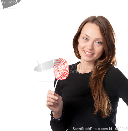 Image of Attractive smiling female holding a lollipop