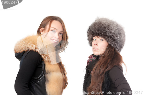 Image of Two attractive women dressed for winter
