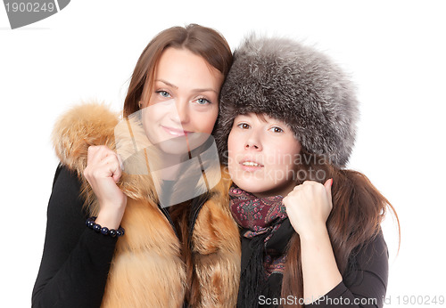Image of Two attractive women dressed for winter