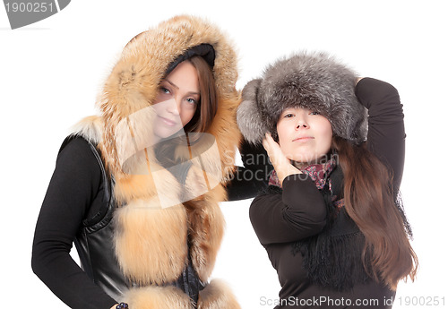 Image of Two attractive women dressed for winter