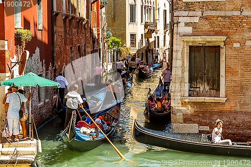 Image of 16. Jul 2012 - Heavy traffic of gondolas on the canal in Venice