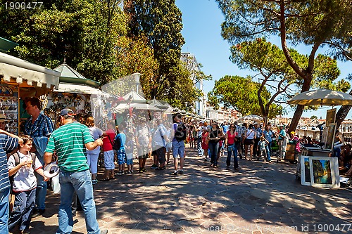 Image of 16. Jul 2012 - Street vendor selling tourist souvenirs. Most vendors in Venice aren't of Italian origin. 